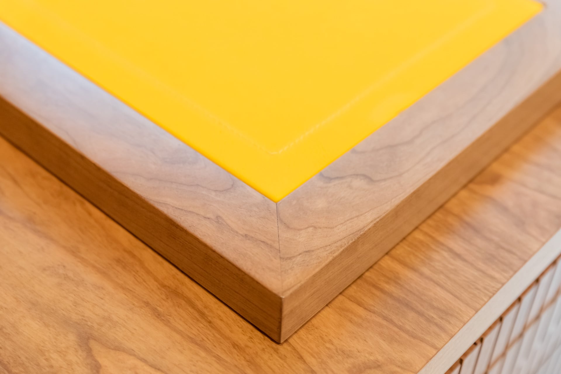 Wooden corner with yellow top of counter