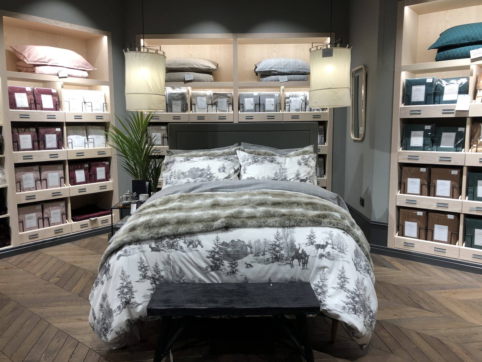 Bed in store with branding all around
