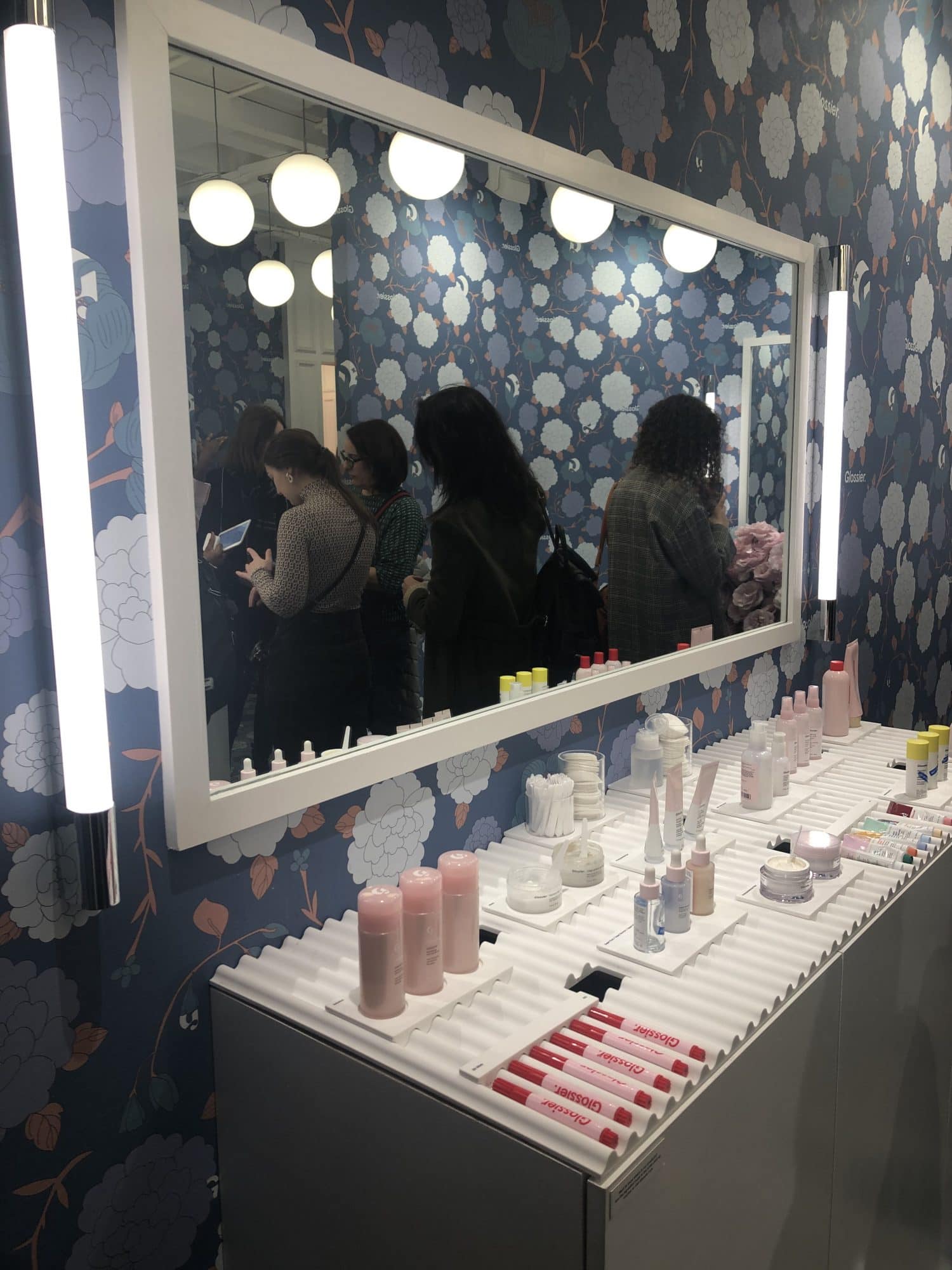 Cosmetic section of Glossier beauty pop-up store