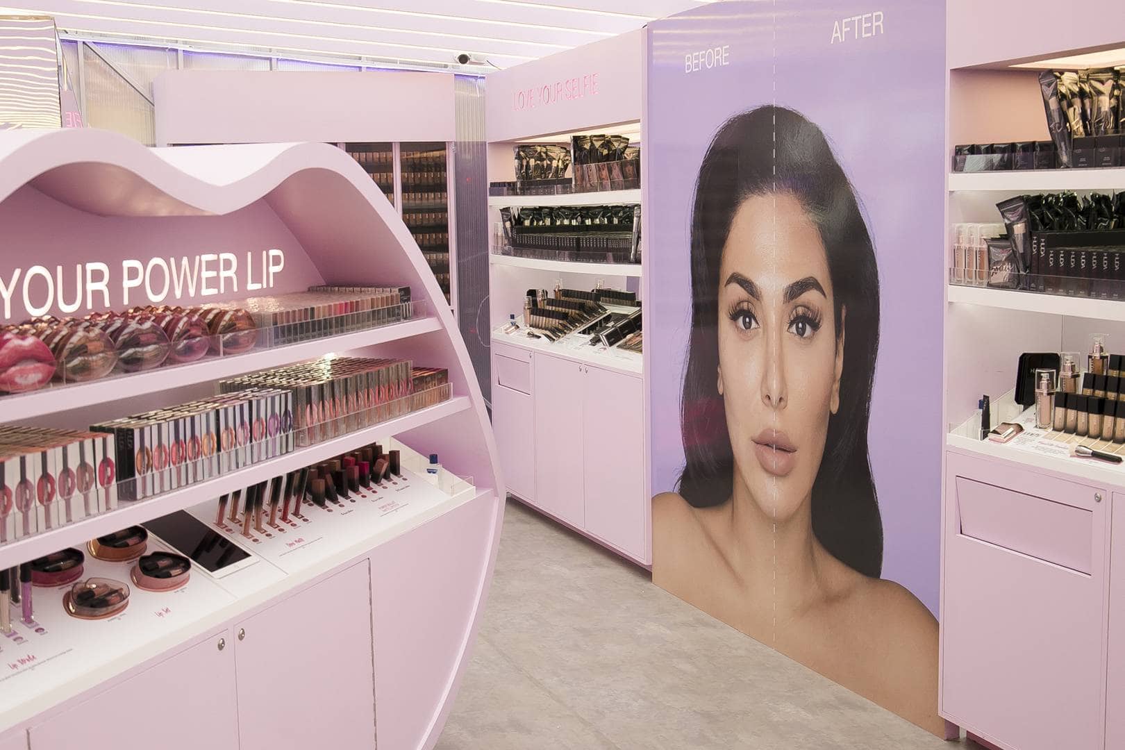 Glossier cosmetics point of sale stand